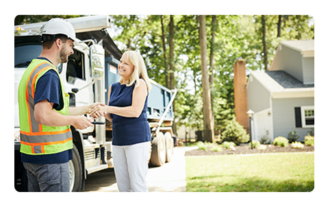 Woman Shaking Hands With Dumpster Truck Driver.