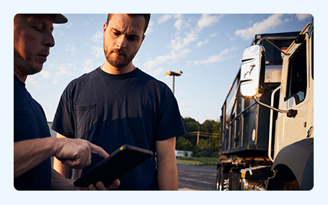 Two Men Looking at Tablet.